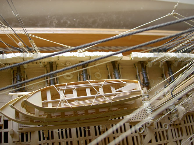 gun deck with ship's boats stowed